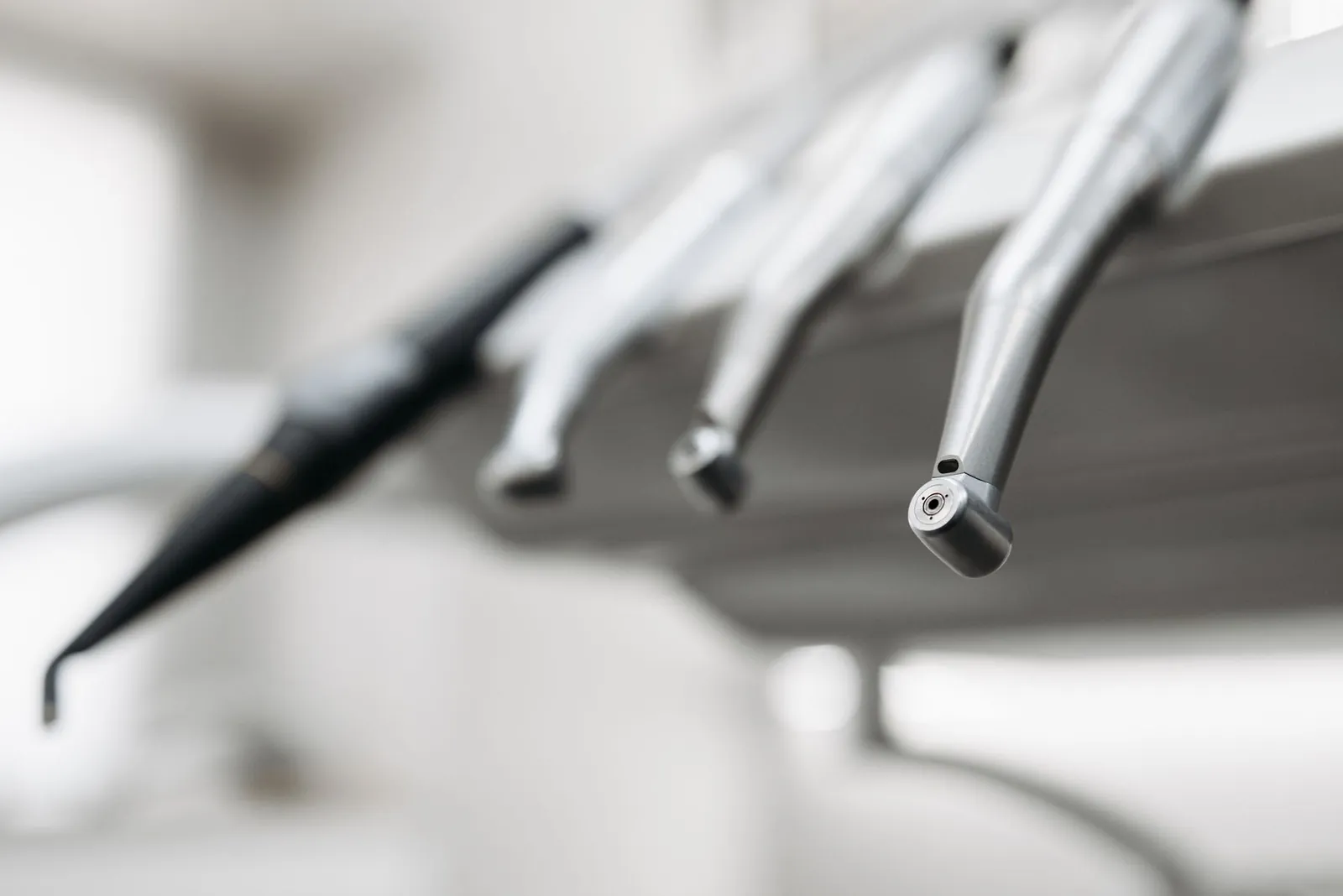 Handpieces on a dental unit.